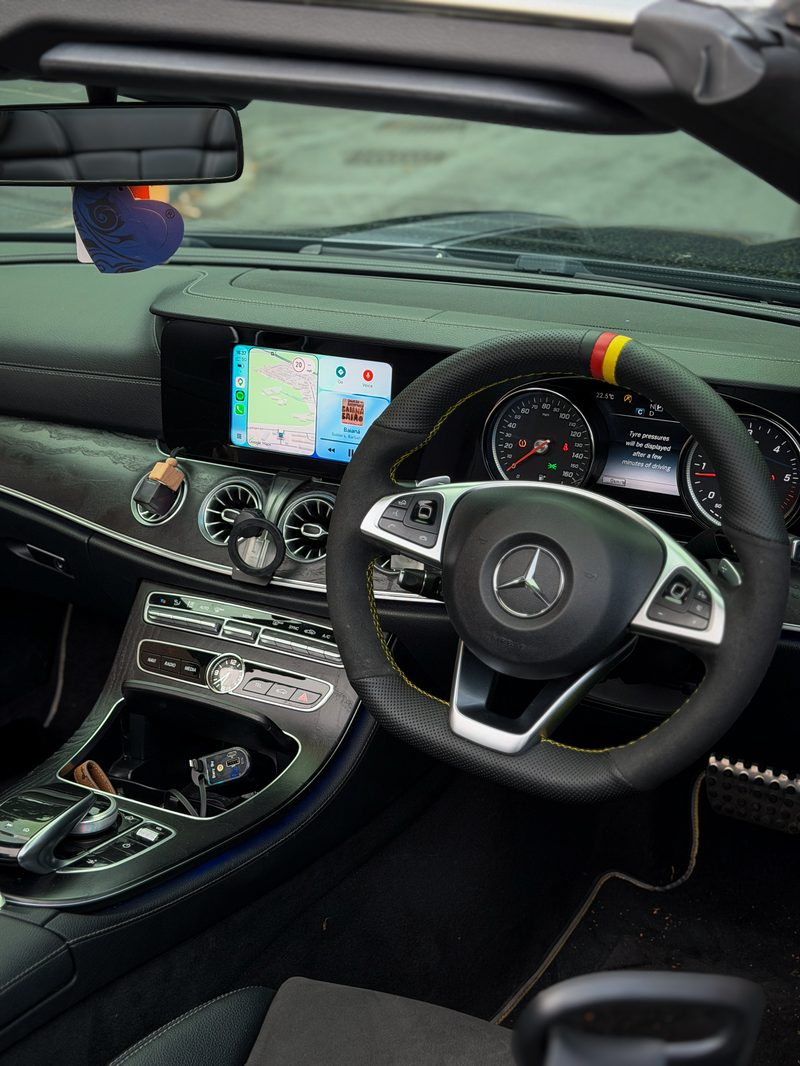 Wide dash view of Apple CarPlay running through the MMI box on a Mercedes