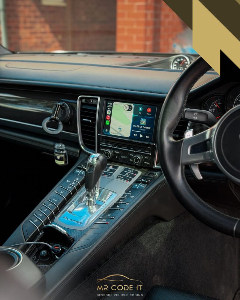 Wide dash view of Apple CarPlay active on a Porsche Panamera