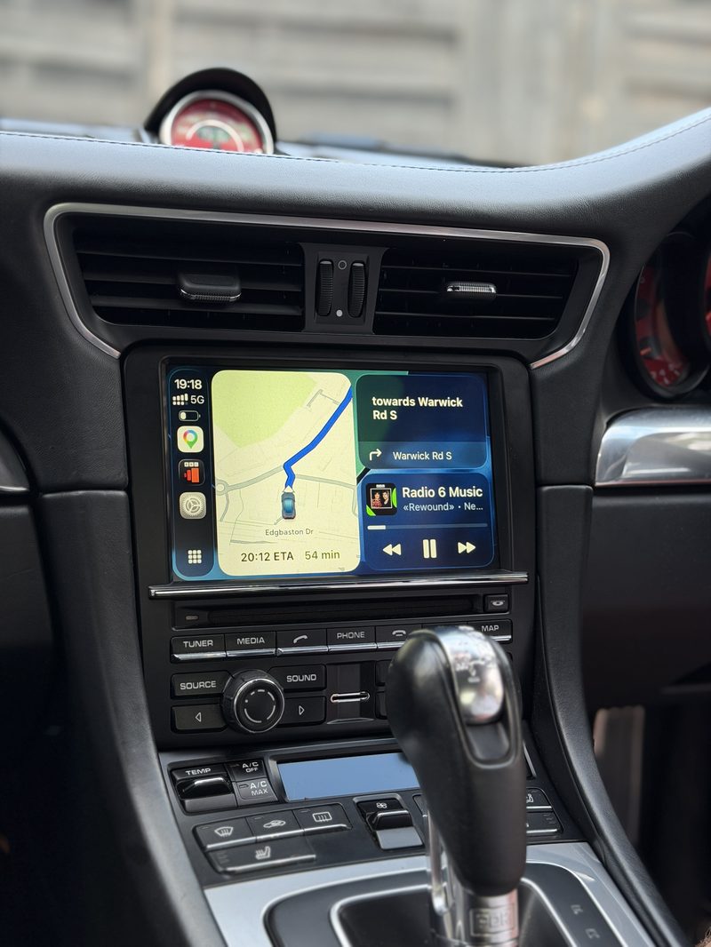 Apple CarPlay navigation and music running on a Porsche 911 PCM3.1 screen