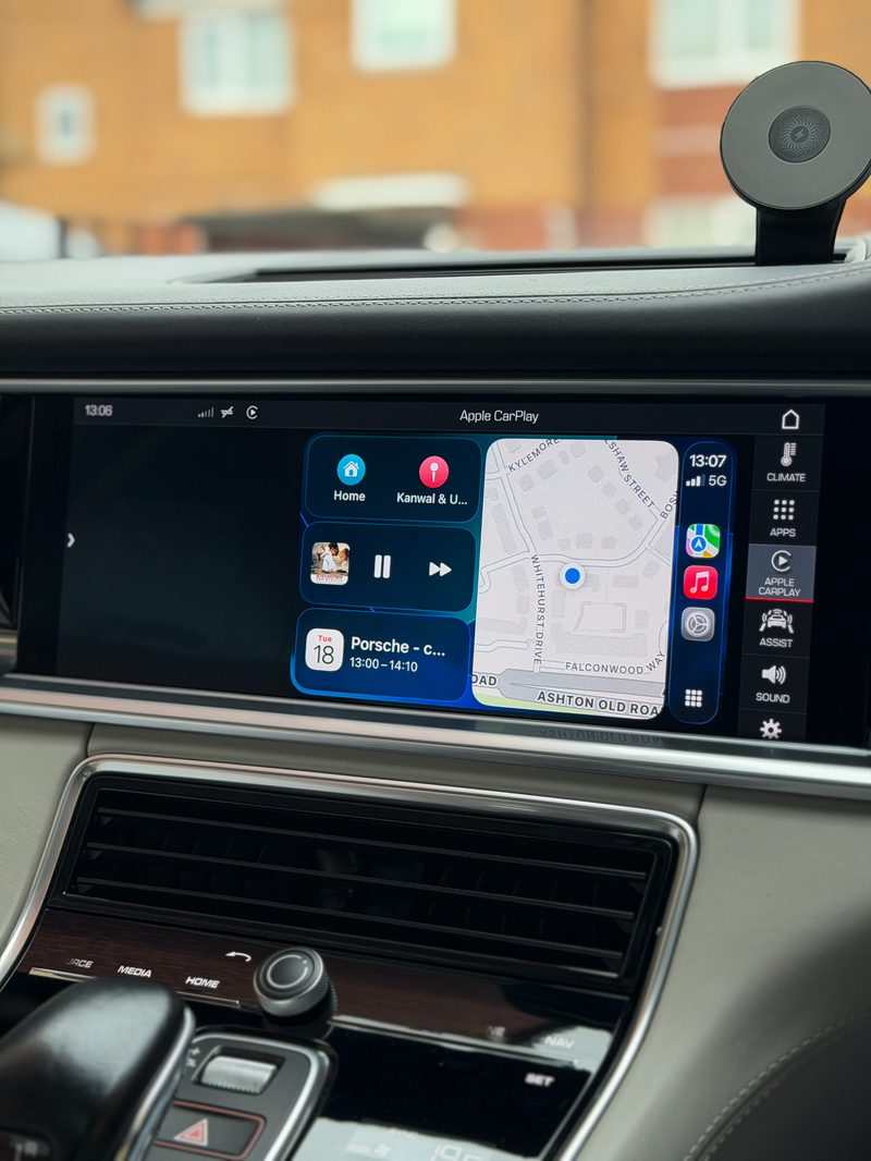 Before — Apple CarPlay confined to a half-screen window on a Porsche PCM4.1 display, navigation view